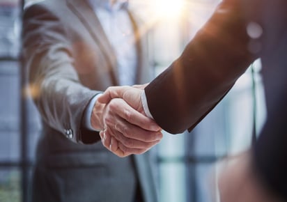 Photo of two men shacking hands